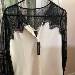 Chico’s white top with black sleeves